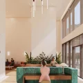 Sảnh lễ tân tầng trệt với tone màu pastel dễ chịu, thiết kế đón nhiều ánh sáng tự nhiên, tiết kiệm điện, được điểm xuyết bởi những cụm cây cảnh.